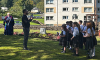 Whinhill Primary Gaelic Choir performing at the Mary of Iona 'The Harvesters' shipping disaster memorial dedication service at the Chapel Street Cemetery, Gourock.